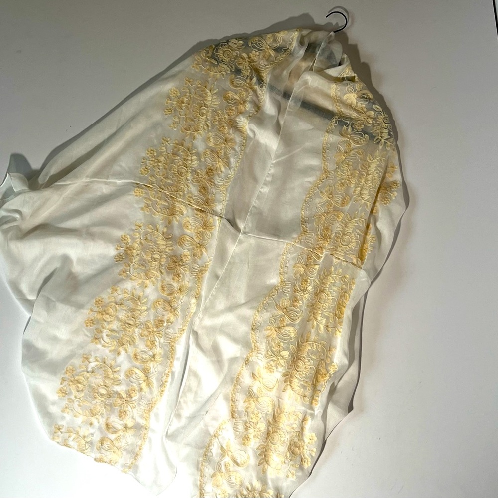 Sheer, creamy white shawl with gold embroidery